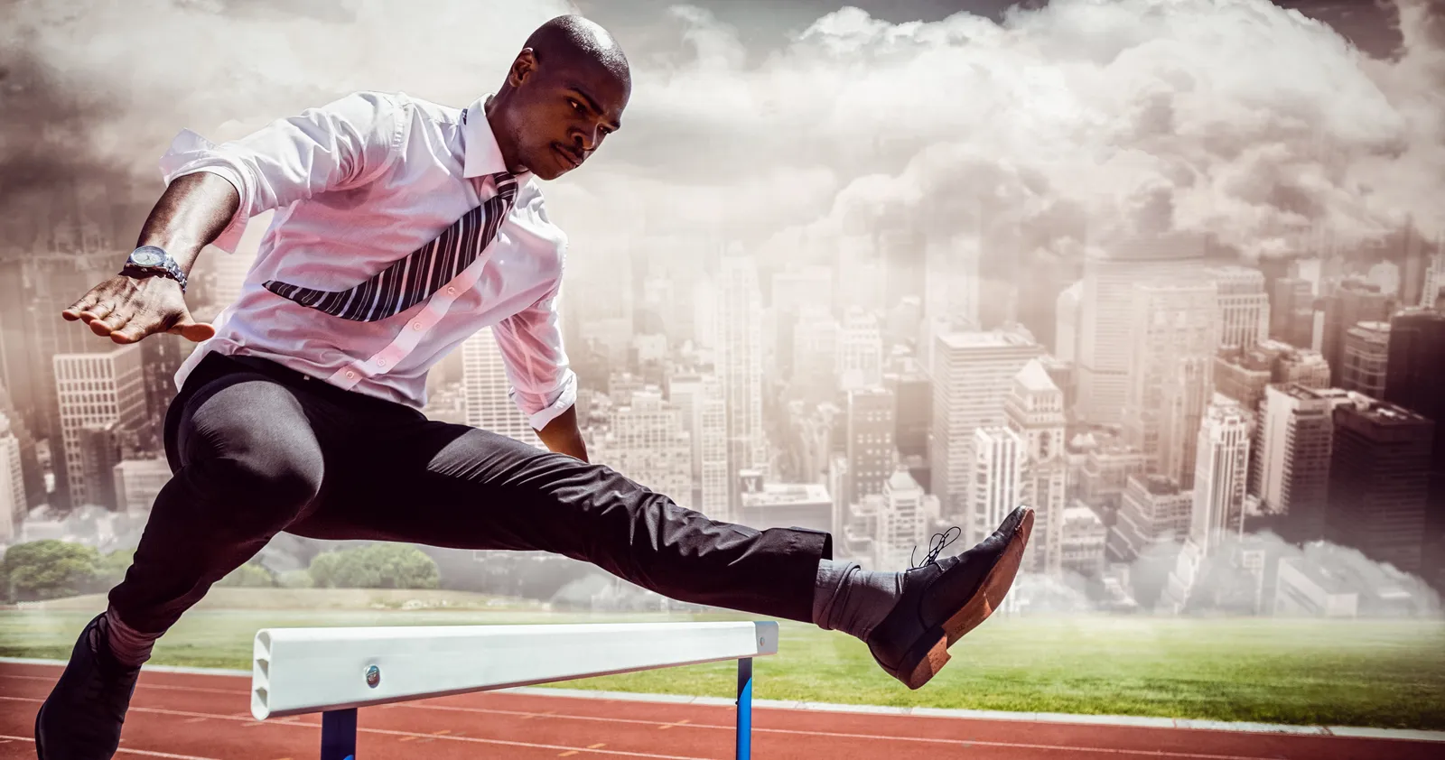 A businessman clearing a hurdle
